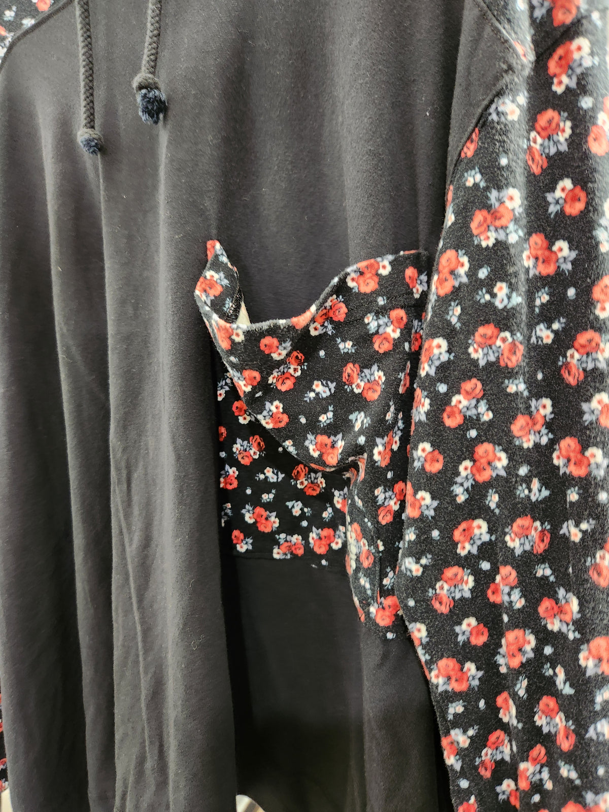 Free People hoodie black color and floral print sleeve and pockets